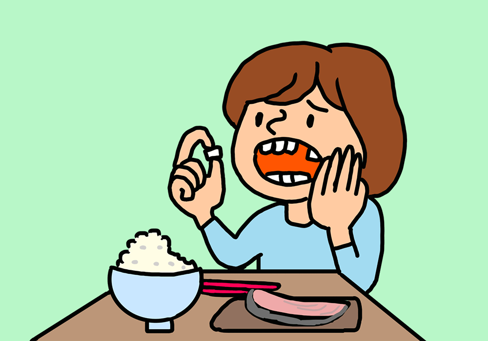 食事中に歯が取れた女性